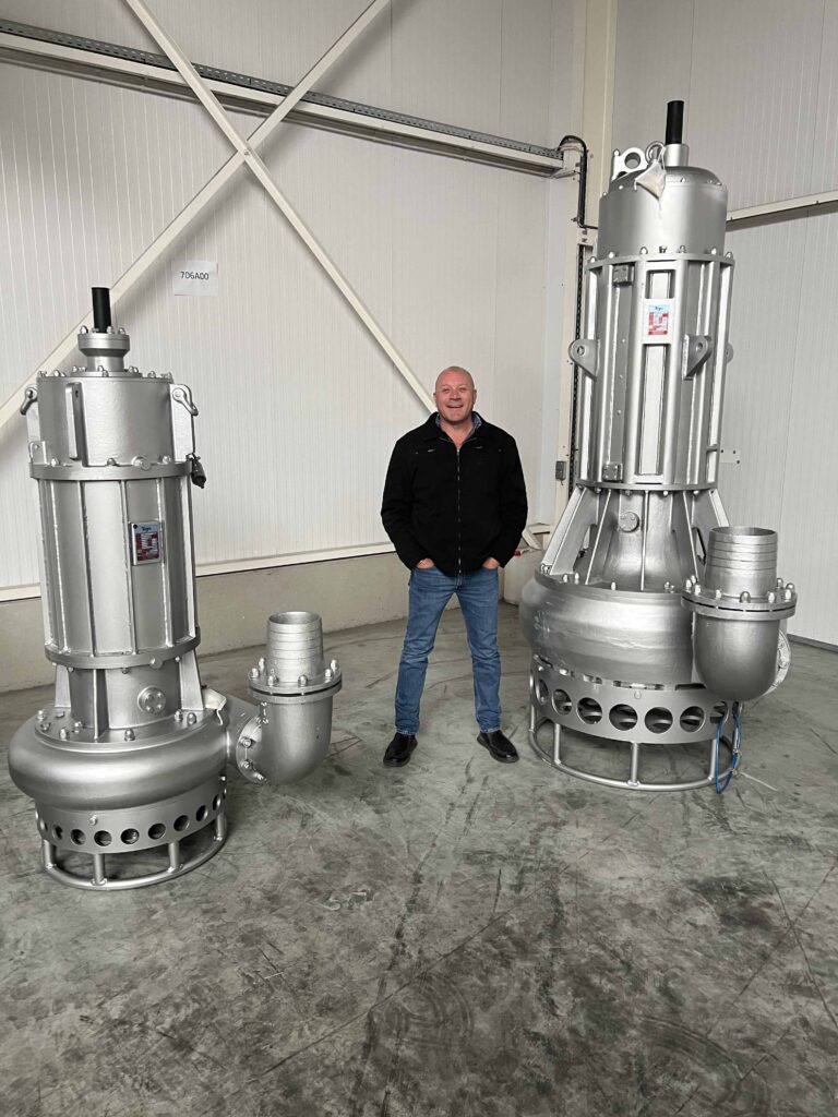 Lee Vine, Managing Director of IPR, standing between Toyo DP100 and Toyo DP120 submersible slurry pumps capable of flows of up to 900 m3 per hour at heads of up to 50 m.